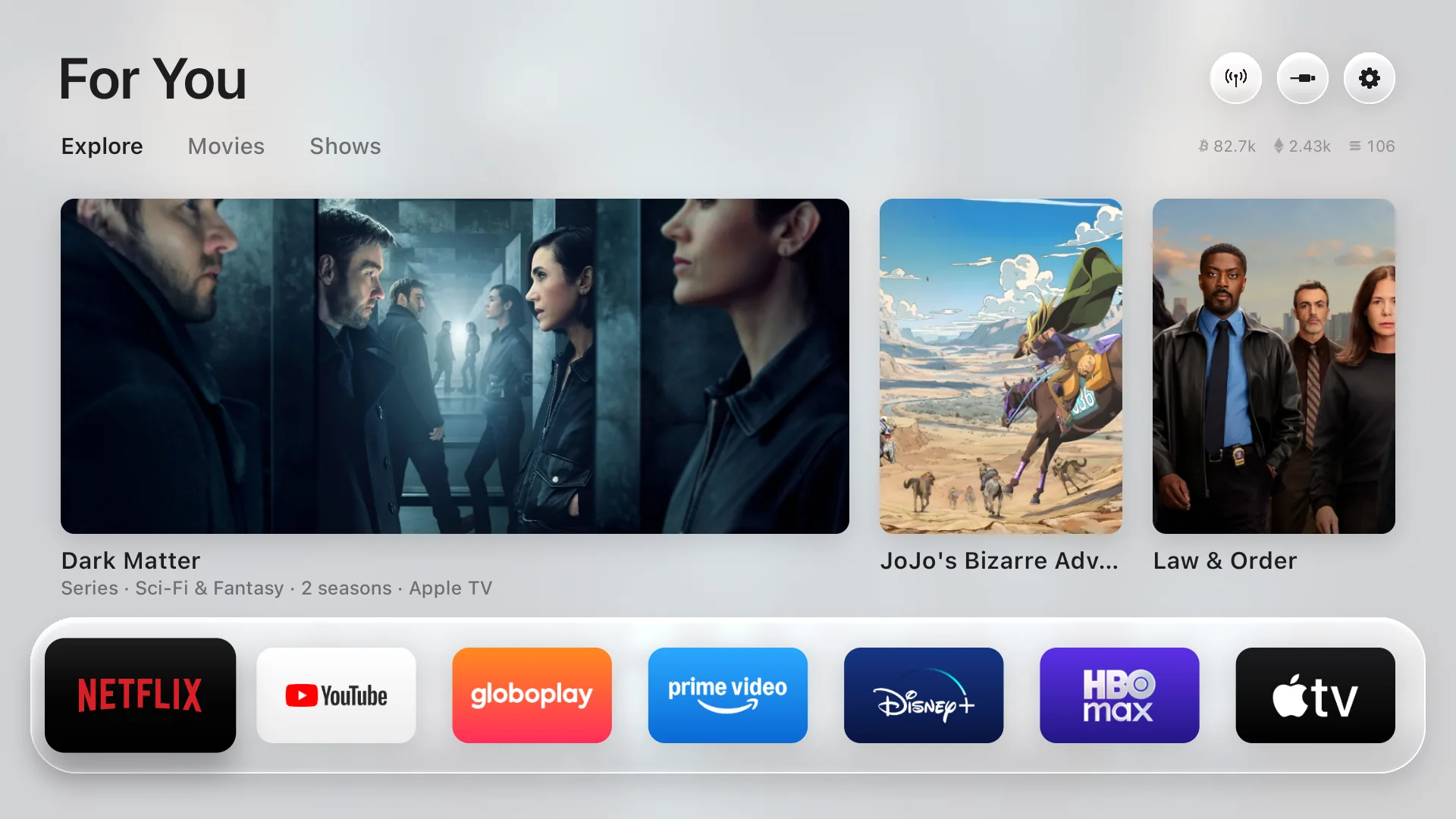 The Free My TV home screen: three picks, a glass shelf of apps